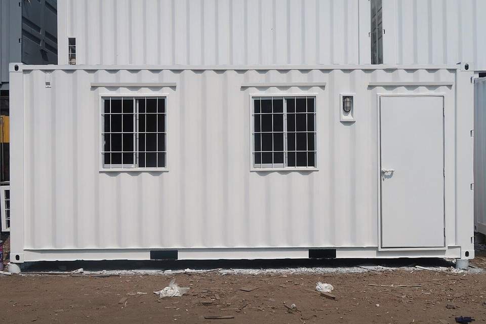 White container office with windows and a man door